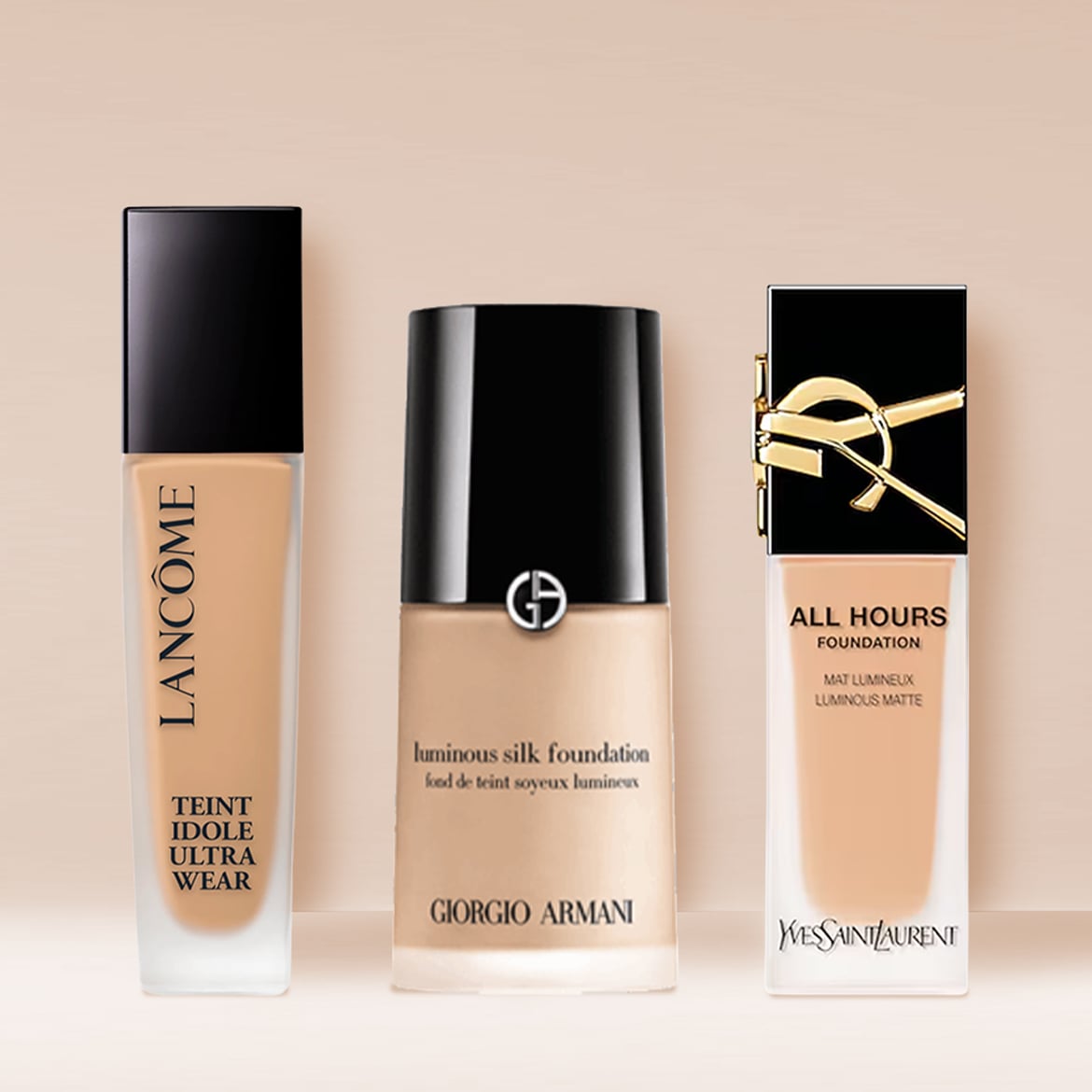 Tre flaconi di fondotinta di Lancôme Teint Idole Ultra Wear, Giorgio Armani Luminous Silk Foundation e Yves Saint Laurent All Hours Foundation.