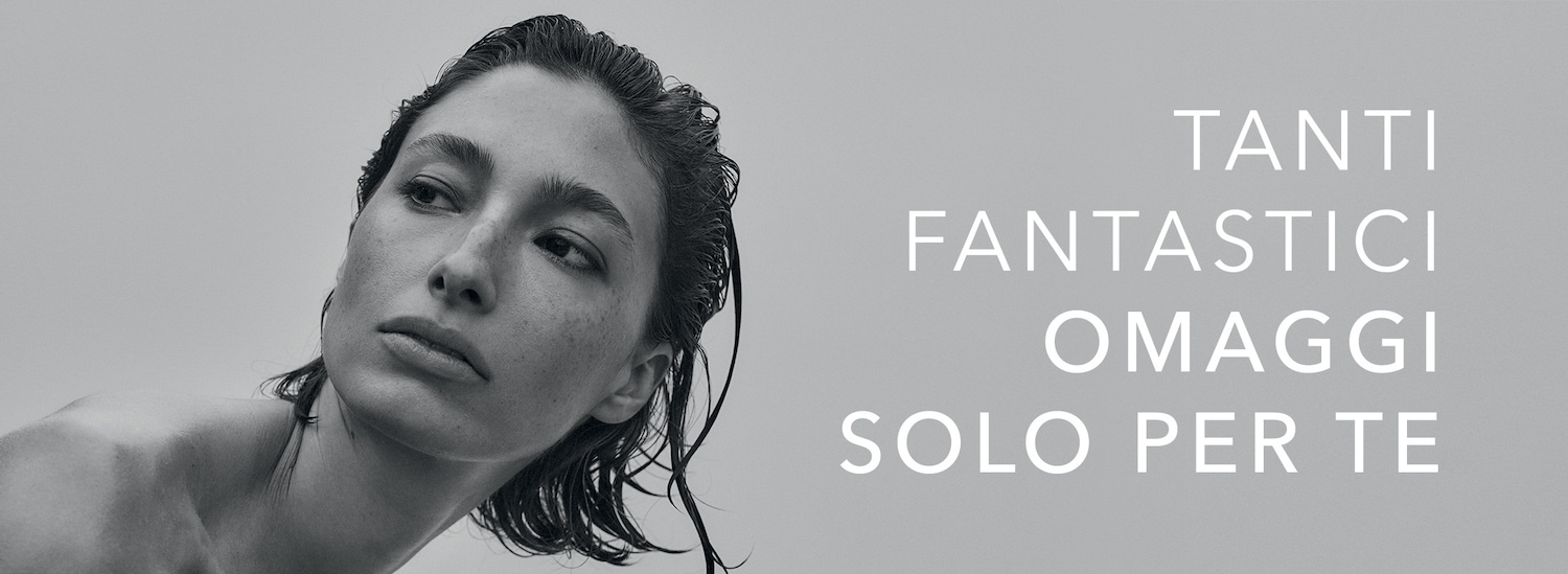 Close-up of a woman with wet hair, looking away, next to the text 'Tanti fantastici omaggi solo per te', which translates to 'Many fantastic gifts just for you'.