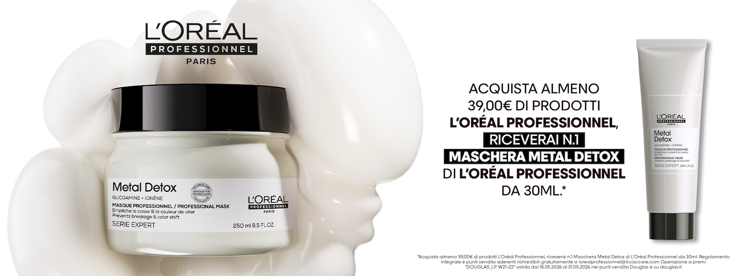 Ecco la maschera Metal Detox di L'Oréal Professionnel in un barattolo bianco con scritte nere, ideale per prevenire rotture e variazioni di colore, accanto al tubo dello stesso prodotto.