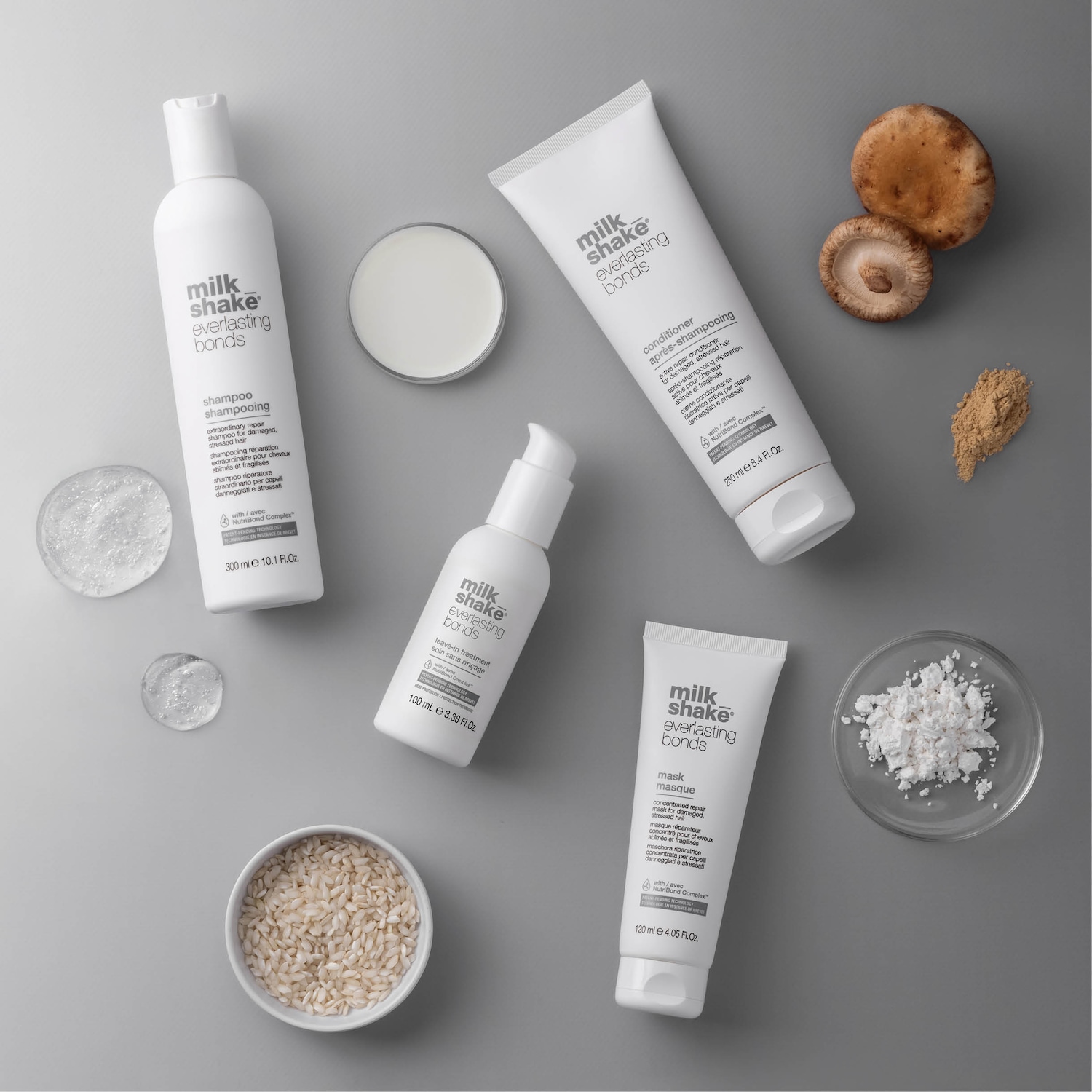 Scopri Milk Shake Everlasting Bonds, la linea completa per la riparazione dei capelli danneggiati e stressati: shampoo, balsamo, maschera e trattamento leave-in in confezioni bianche.