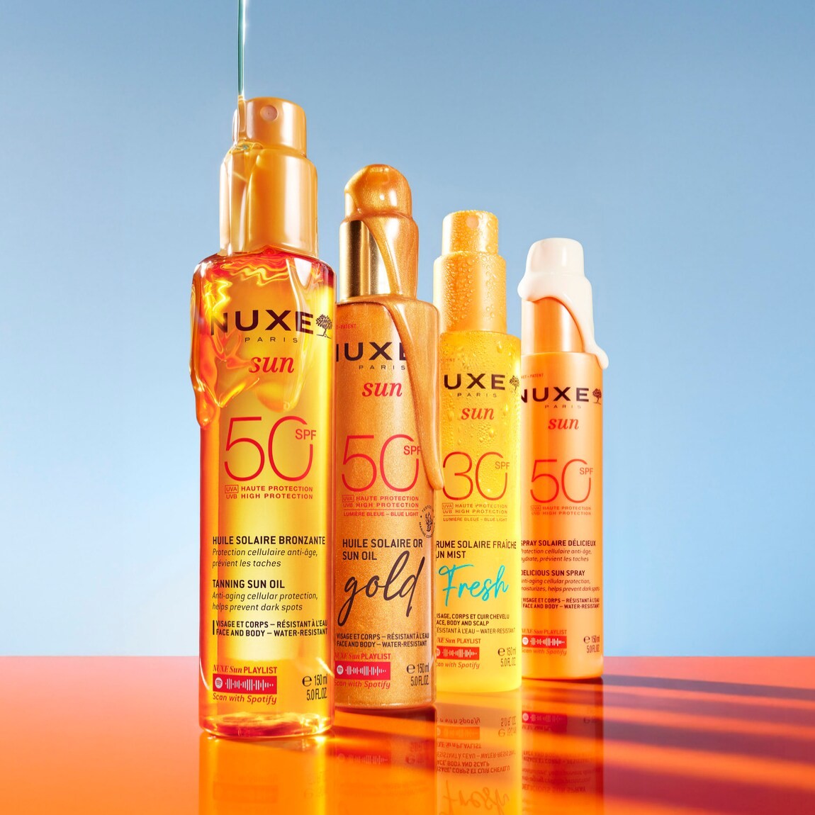 Quattro flaconi di protezione solare Nuxe Sun con SPF 50 e 30, ideali per proteggere la pelle dai raggi UVA e UVB, con oli solari abbronzanti e spray deliziosi.