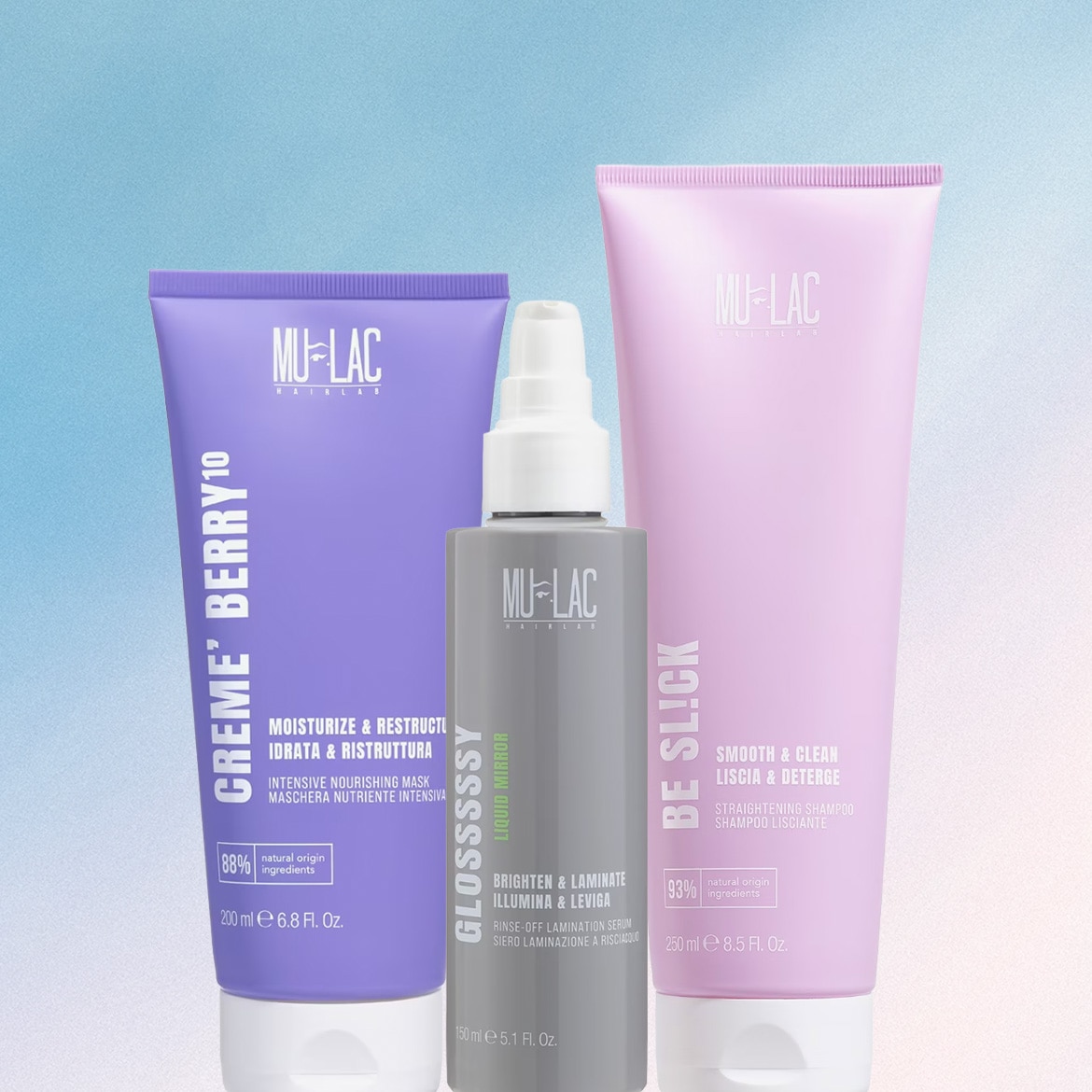 Tre prodotti per capelli Mu-Lac Hairlab sono mostrati in primo piano: una maschera nutriente viola, un siero laminante grigio e uno shampoo lisciante rosa, tutti con etichette bianche e nere.