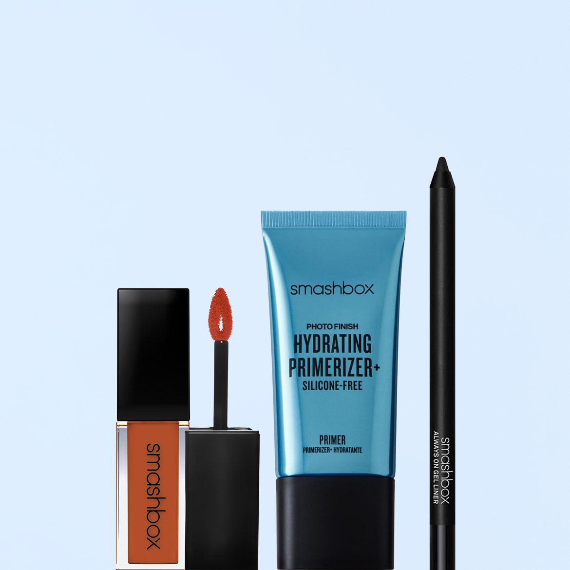 Un rossetto liquido arancione opaco Smashbox con applicatore, un primer idratante Photo Finish Hydrating Primerizer+ Silicone-Free e una matita eyeliner nera Always On Gel Liner.