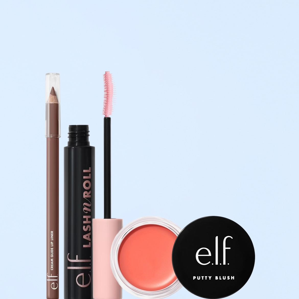 Un set di prodotti e.l.f. Cosmetics, tra cui una matita labbra marrone, un mascara nero con scovolino rosa e un blush in crema color pesca in una confezione nera e trasparente.