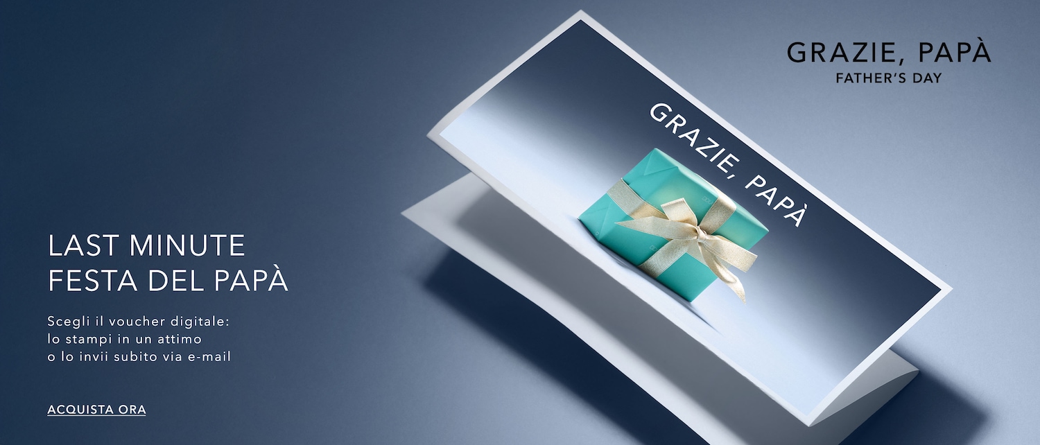 Regala a tuo padre un buono digitale per la Festa del Papà, con una confezione regalo color verde acqua con nastro dorato, su sfondo blu con la scritta “Grazie, Papà”. Acquista ora.
