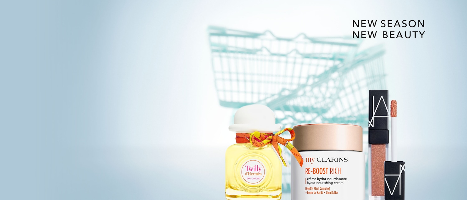 Scopri la nuova stagione della bellezza con Twilly d'Hermès Eau Ginger, una fragranza floreale speziata in un flacone quadrato con un cappello bianco e un nastro colorato.