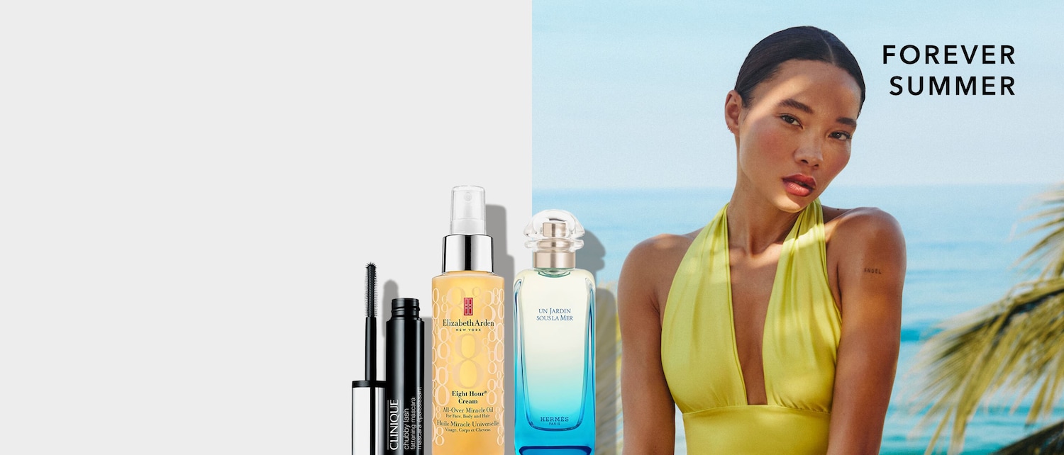 Esplora la bellezza senza tempo con Clinique Chubby Lash mascara nero, Elizabeth Arden Eight Hour Cream olio miracoloso dorato e Hermes Un Jardin Sous la Mer profumo in una bottiglia sfumata azzurra.