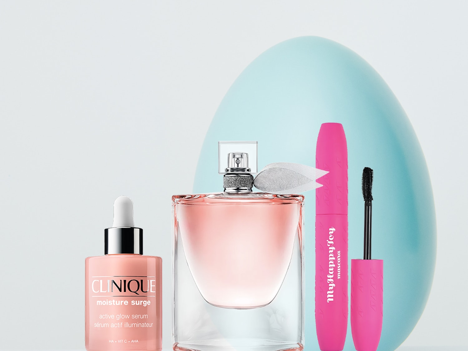 Ecco un set di bellezza con siero Clinique Moisture Surge, profumo rosa e mascara My Happy Toy.